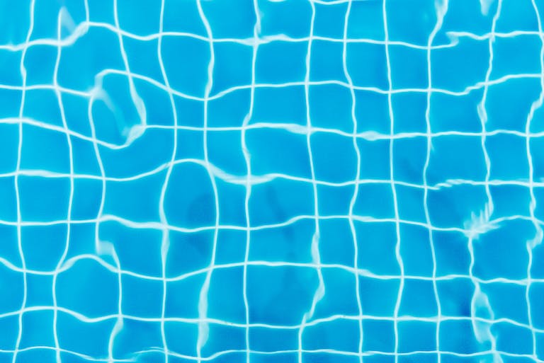 Top View Photography of Blue Pool Tiles